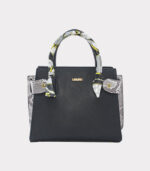 carteras trapecio con costados animal print piton